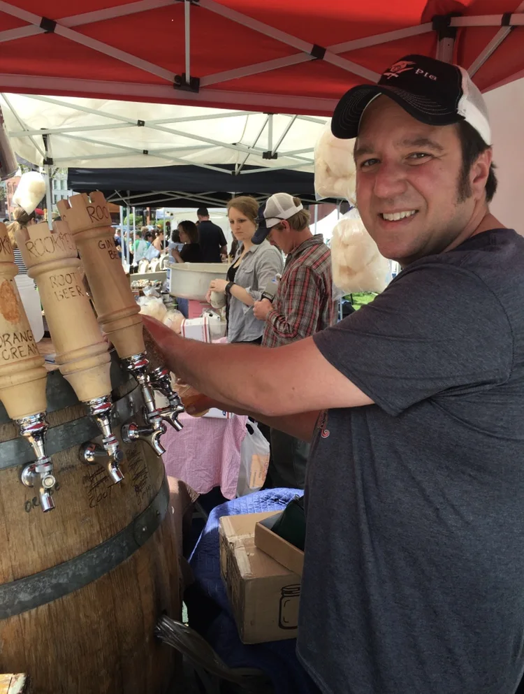 Pouring a drink at a Vermont market